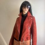 Faux suede rust coloured short moto jacket with zippers. Sz S